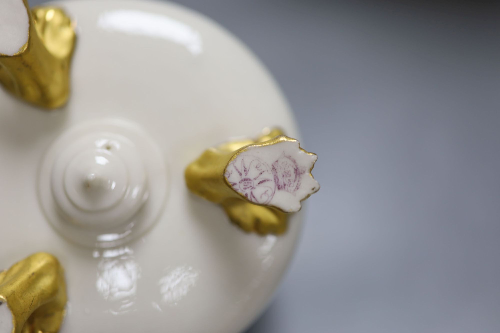 A Royal Worcester ewer, in the Persian style, a shell and dolphin centrepiece and a vase, tallest 30cm